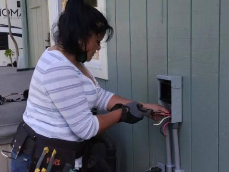 Licensed electrician wiring an exterior subpanel in Cottleville